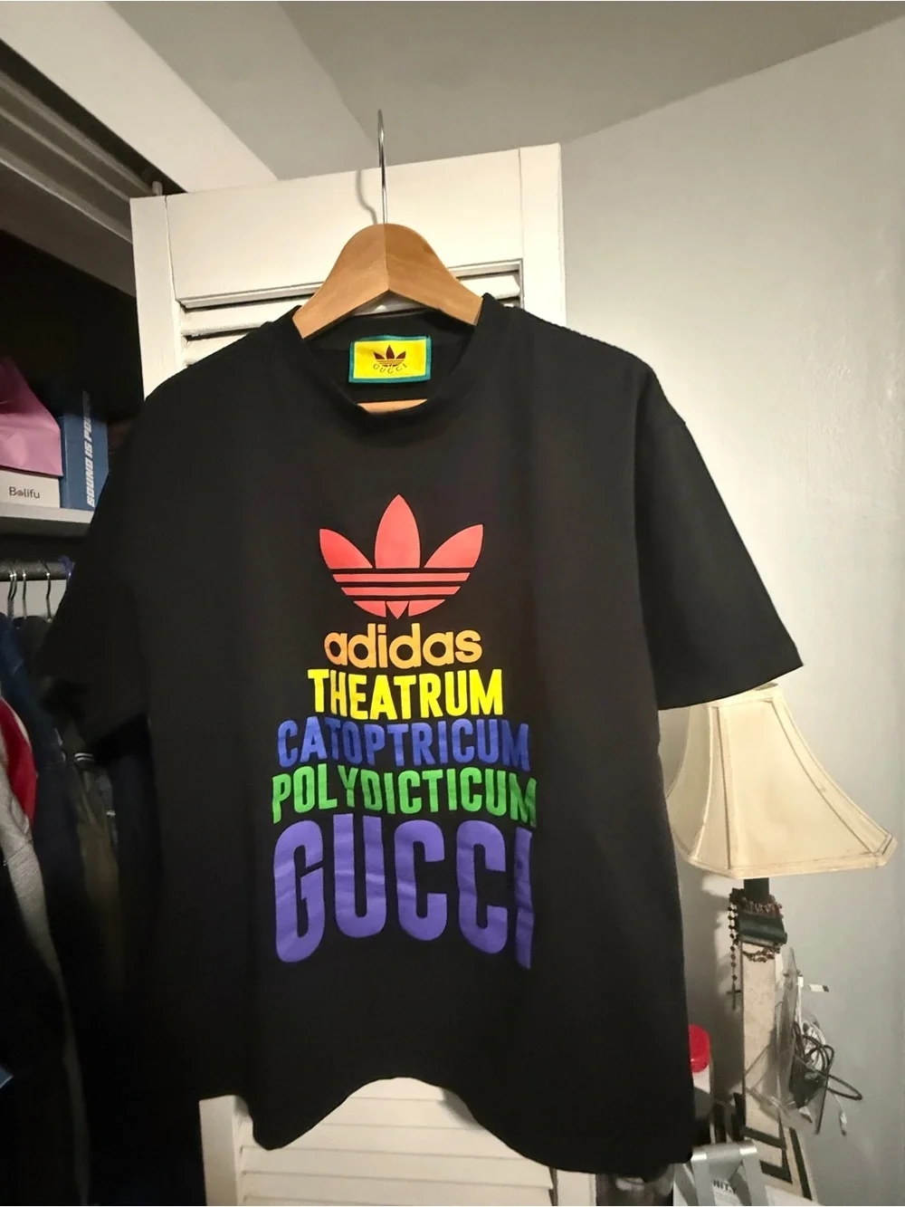 Gucci Black Tee with Red Trefoil Logo and Yellow Neck Label
